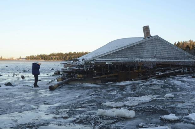 This century-old McCurdy's Smokehouse brining shed was swept on to the beach at Campobello Island, N.B., from Lubec, Me.