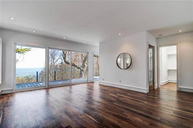 The master suite has a panoramic view of the landscape.