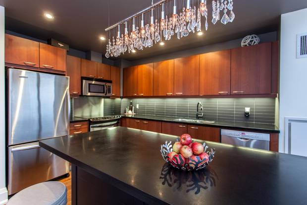 The big island doubles as an eating space and storage space.