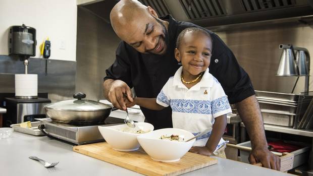 Chef Philman George and his son Zaihman prepare clams in white wine sauce at High Liner Foods in Vaughan, Ontario Saturday June 4/2016.