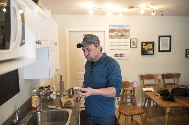 Brian Erskine snacks on Rocky Shore oysters after the holiday oyster harvest at Future Seafood Inc.