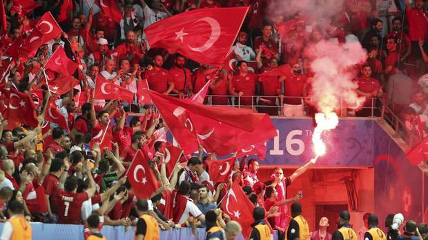 Turkish fans light flares during the Euro 2016 Group D soccer match between Spain and Turkey at the Allianz Riviera stadium in Nice, France, Friday, June 17, 2016.