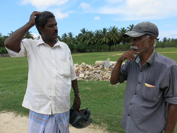 The first two men in Atchuvely who offered us help in finding my dad's house.