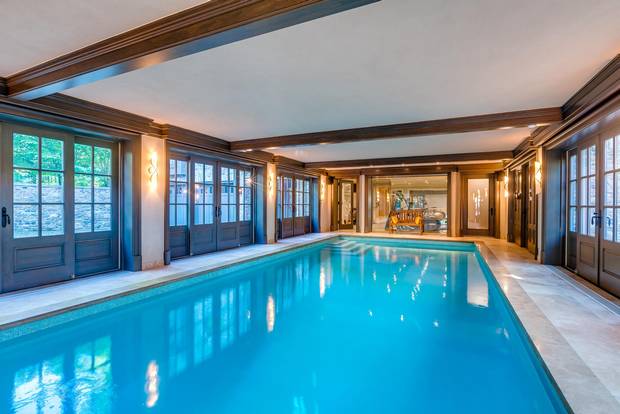 Sliding doors allow for a breeze to enter the indoor pool on warm days.