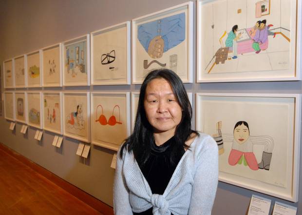 Annie Pootoogook with her work.
