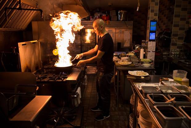 Chef and owner Yue Shen prepares the Beijing stir fry with flour balls and vegetables at Nine Dishes & Cafe 1029 in Richmond, B.C., on Wednesday July 19, 2017. Darryl Dyck/The Globe and Mail