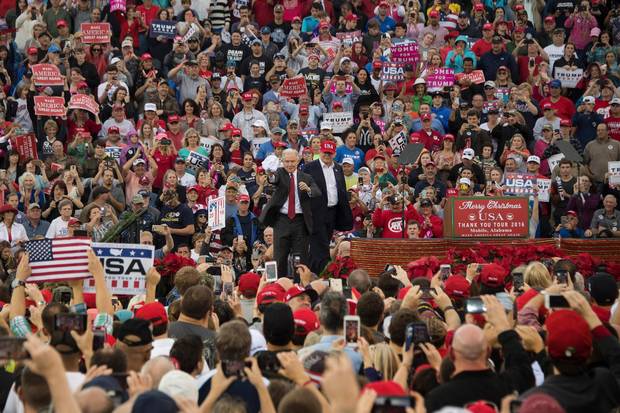 US President-elect Donald Trump (C) introduces US Senator Jeff Sessions as his nominee for US attorney general during a 'Thank You Tour 2016' rally on December 17, 2016 in Mobile, Alabama.