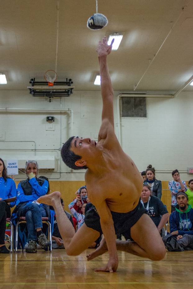 Matthew Angus Anikina competes in the one hand reach during the 2018 Arctic Winter Games in Fort Smith. The one hand reach requires athletes to prop themselves up on one hand and touch a seal skin ball with their other hand before returning to balance themselves on two hands without any other part of their body touching the ground. Nunavut's Drew Bell ended up setting a new Arctic Winter Games record this year after reaching a height of 5 foot 7 inches on his third and final attempt.