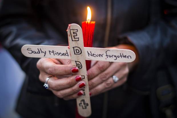 Kim Young attends a vigil for her son, Eddie.