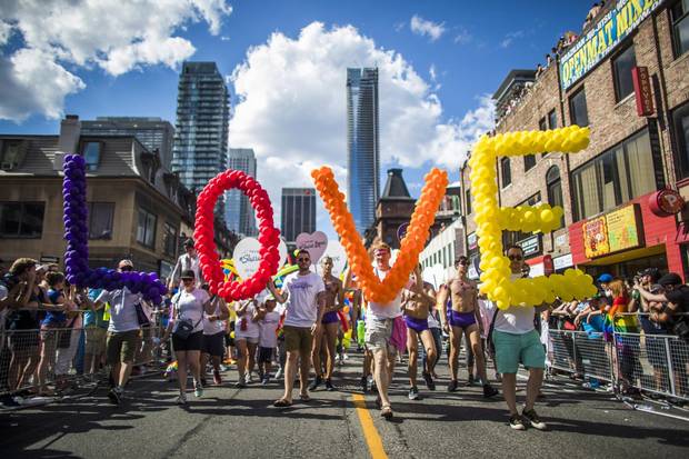 People march in the Toronto Pride Parade, Sunday, July 3, 2016.