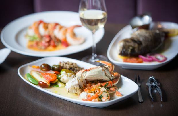 Provence Marinsaside serves whole Dungeness crab drenched in a lemony olive oil that you crack, pick and dip until the sauce drips down your elbows.