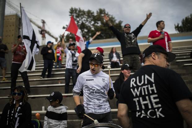 Fans sing as the Toronto Wolfpack play the Whitehaven at Lamport Stadium on Sept. 2. The Wolfpack has been drawing thousands of fans with decent prices for tickets, food and beer.