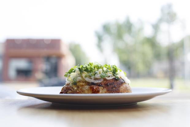 Flammkuchen, a sourdough base smothered in onions and Maroilles cheese.