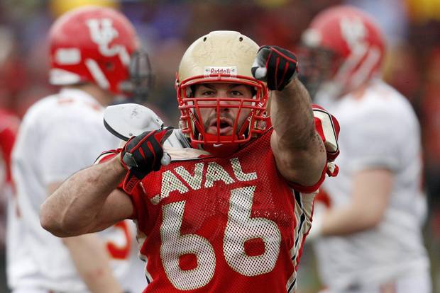 Laval University Rouge et Or Etienne Legare celebrates his sack against Univeristy of Calgary Dinos' quarterback Deke Junior during the second quarter of the Uteck Bowl college football game at Laval University in Quebec City.