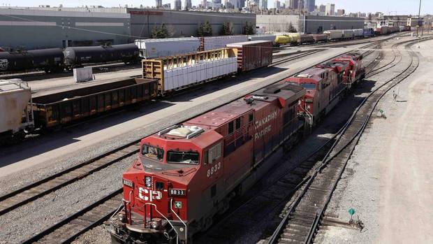 A Canadian Pacific Railway crew works on their train at the CP Rail yards in Calgary.