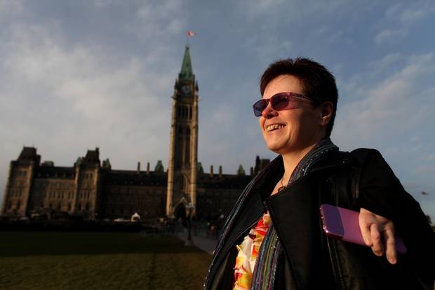 Thalidomide survivor Susan Wagner-White walk on the front steps of Parliament Hill on Dec. 1, 2014.
