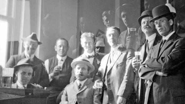 A group of men drinking beer in Vancouver, B.C., circa 1912. 