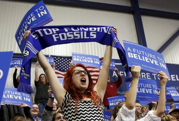 Supporters of Democratic U.S. presidential candidate Bernie Sanders cheer during his rally at Great Bay Community College in Portsmouth, New Hampshire on FEb. 7 2016.