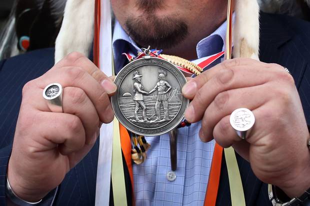Ottawa, 2013: At a protest on Parliament Hill, Grand Chief Derek Nepinak of the Assembly of Manitoba Chiefs displays a seal commemorating a treaty between Indigenous people and the Crown. In 2012 and 2013, the Idle No More movement's emergence drew renewed attention to Indigenous nationhood and treaty rights in Canada.