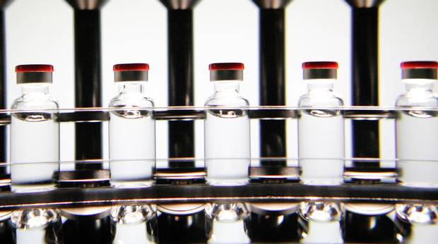 Candling vials of flu vaccine at the Sainte Foy Vaccine Production Facility in Quebec City, Quebec