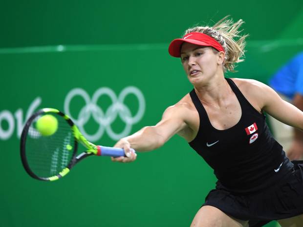 Canada's Eugenie Bouchard returns to Sloane Stephens, of the United States, in first round women's singles tennis at the 2016 Olympic Games in Rio de Janeiro, Brazil on AugUST 6, 2016.