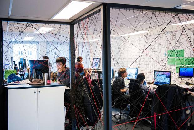 Employees work at Spotify's former head office in Stockholm on February 16, 2015.