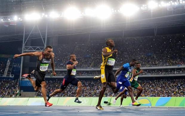 Canada's Andre De Grasse, France's Jimmy Vicaut, Jamaica's Usain Bolt, United States' Justin Gatlin and South Africa's Akani Simbine race in the men's 100-metre final during the athletics competition at the 2016 Olympic Games in Rio de Janeiro, Brazil on August 14, 2016. Bolt won gold, Gatlin won silver and De Grasse won bronze. 