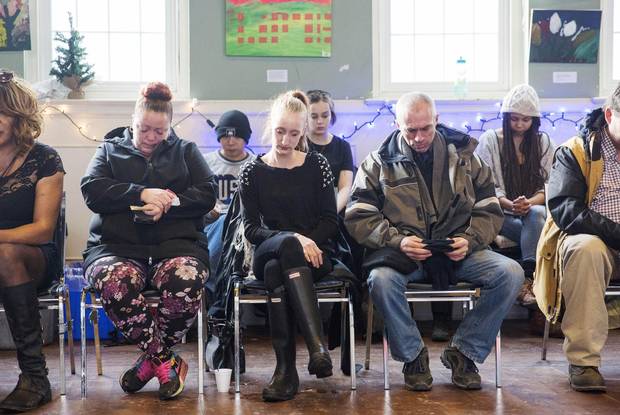 From left, Ms. Wells' cousin Melissa Jackson, cousin-in-law Caitlin Daley and father Michael Wells, joins the room of loved ones, friends and supporters at her memorial.