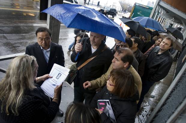 Realtors queue up on Bloor Street West in November, 2008, waiting for a number so they can wait in line again later to purchase a condominium in the new X2 development.