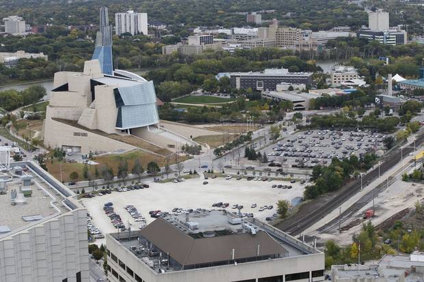 Parking spaces sprawl out beside Winnipeg’s Canadian Museum for Human Rights, one of the signature attractions of the Forks, a historic site where the Red River meets the Assiniboine River.