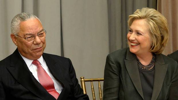 Former U.S. Secretaries of State Colin Powell and Hillary Clinton are shown on Sept. 3, 2014.