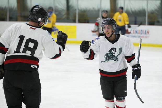 Justin Connelly, right, celebrates his goal with team captain Michael Bell.