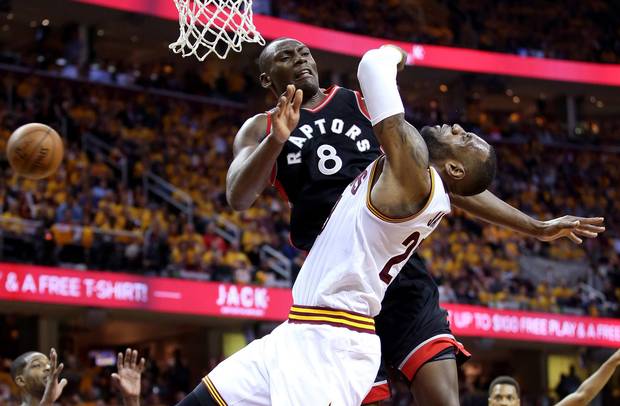 Bismack Biyombo #8 of the Toronto Raptors collides with LeBron James #23 of the Cleveland Cavaliers in the third quarter.