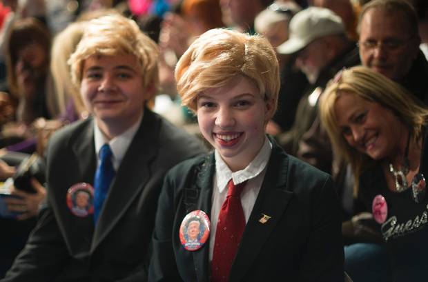 Fourteen-year-old supporters Kaylie Kilpatrick and her friend James Hanna (left) dress like Republican presidential candidate Donald Trump during a campaign rally in Sumter, South Carolina ahead of the state’s primary.