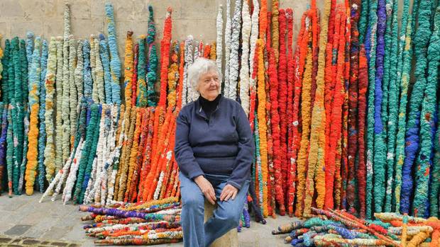 Sheila Hicks, seen in 2015, admits to being a bit of a scavenger, who likes being open to using unconventional materials in her work. in front of elements from The Treaty of Chromatic Zones, 2015. Photo by Cristobal Zanartu.