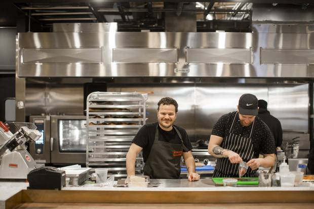 Chef Rob Bragagnolo, centre, and Chef de cuisine Jesse Mutch in the kitchen at Campo.