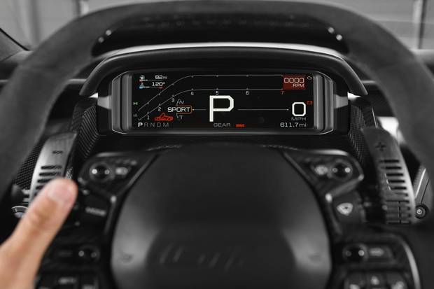 As the driver shifts gears, lights along the top of the steering wheel streak from left to right and change colour in lightning-like fashion.