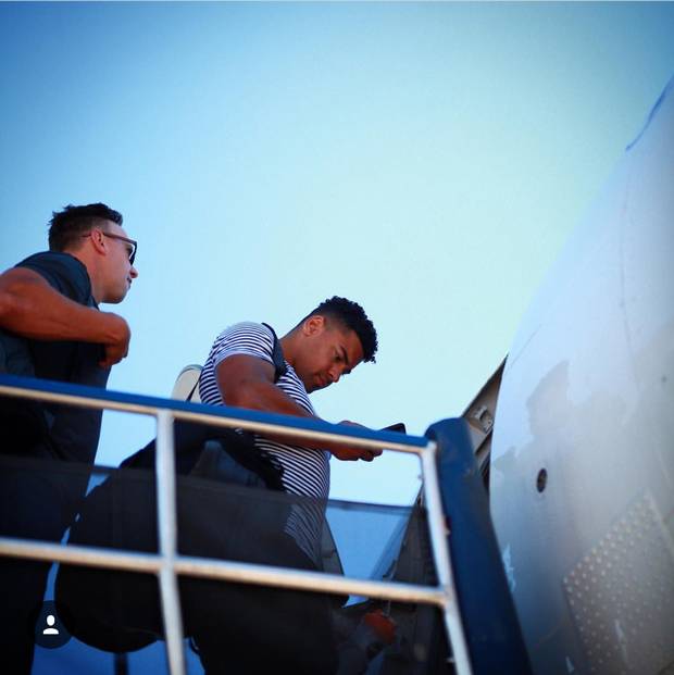 The Winnipeg Blue Bombers deboard a plane.