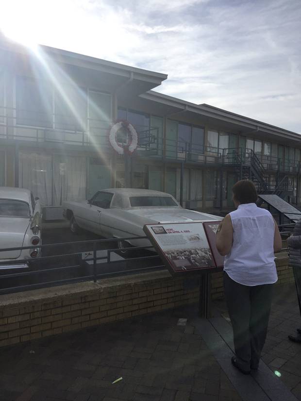 The motel and its environs are now home to the National Civil Rights Museum. Here, a woman stands at the site where Dr. King was killed.