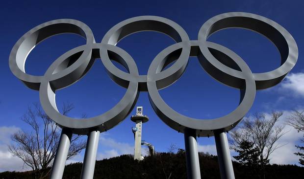 The tower at the top of the Alpensia Ski Jumping Centre rises beyond a set of Olympic rings in Pyeongchang, South Korea on Feb. 2, 2018.