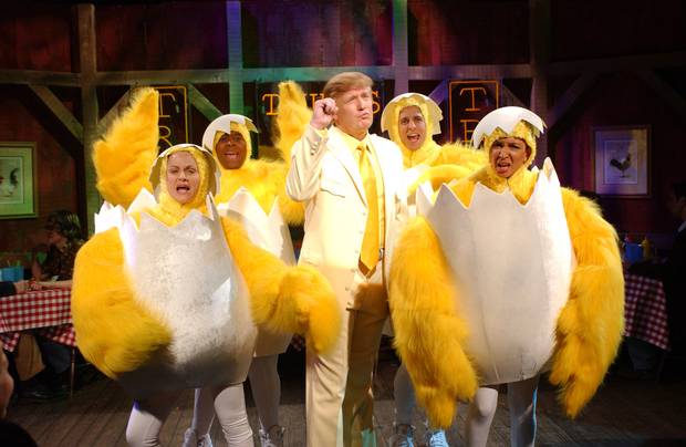 Donald Trump sings with Saturday Night Live cast members in 2004.