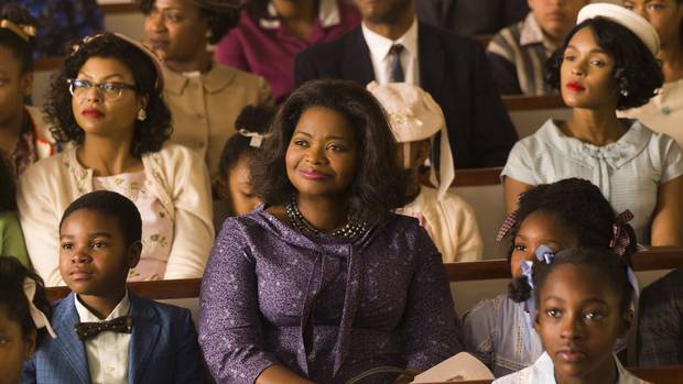 Taraji P. Henson, background left, Octavia Spencer, center, and Janelle Monae, background right, in Hidden Figures.