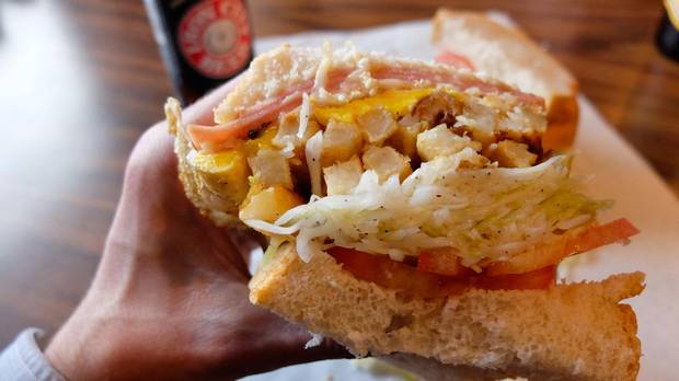 Pittsburgh's signature sandwich is the best-seller at Primanti Bros. and features sliced meat, french fries and coleslaw on sliced Italian bread