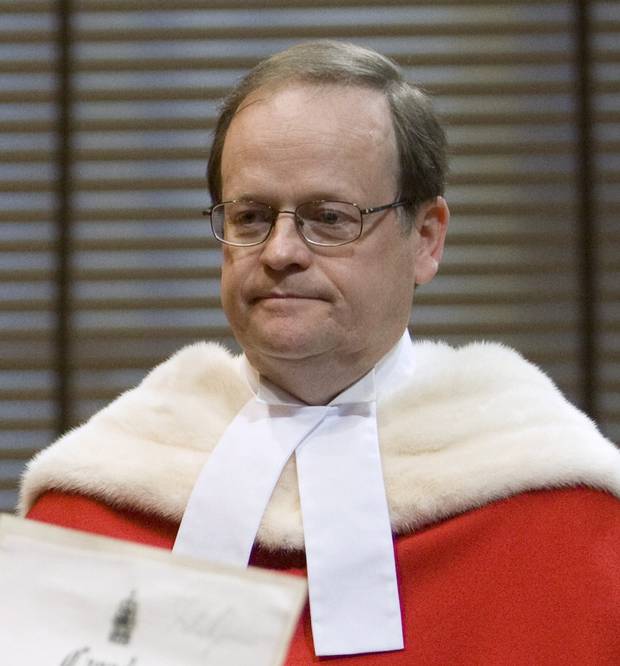Justice Thomas Cromwell is sworn in by deputy registrat Louise Meagher during a public ceremony at the Supreme Court of Canada in Ottawa, Monday Feb. 16, 2009. 