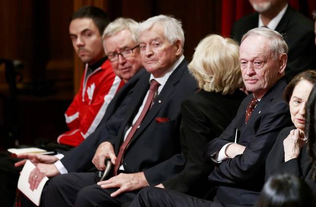 Former Canadian prime ministers Joe Clark, second left, John Turner, middle, and Jean Chrétien, right, look on ahead of the delivery of the speech.