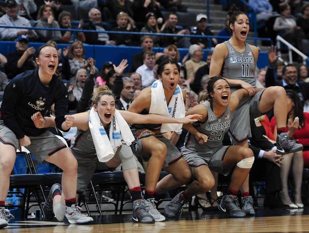 From the left Connecticut's bench celebrates the second half of an NCAA college basketball game against South Florida, Tuesday, Jan. 10, 2017, in Hartford, Conn. UConn heads into the NCAA tournament looking for their fifth consecutive championship.