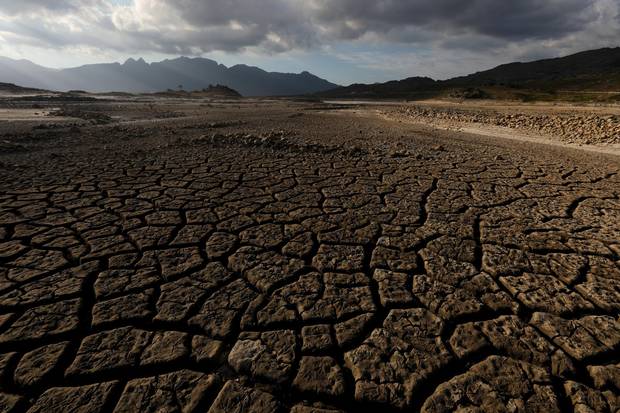 Sand blows across a normally submerged area at Theewaterskloof dam near Cape Town Jan. 21, 2018.