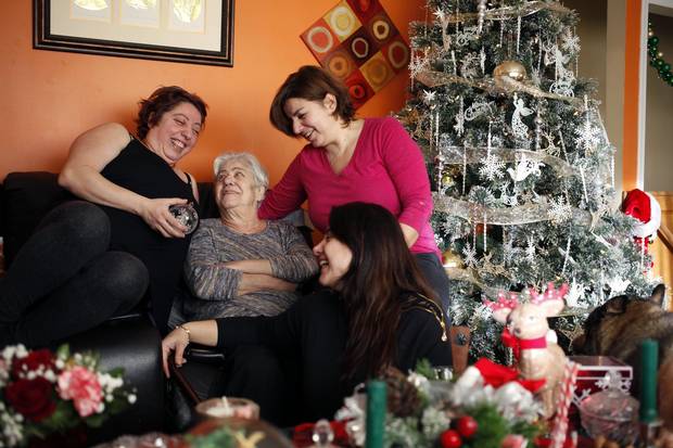 Merell Awad, left, with her mother Samira, and sisters Rania and Huda at home in Campbell River, B.C., on Dec. 20, 2017.