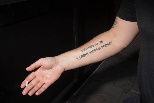 Avery smokes a cigarette outside of his building in New York. The former agitator was bothered by the idea that readers of this piece might come away with an incomplete impression of him as a person. 