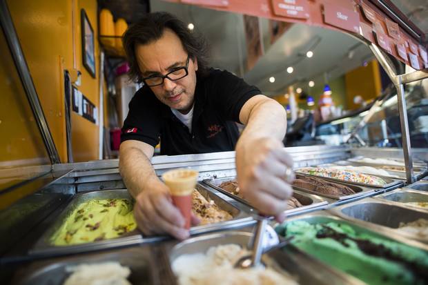Dino Carella scoops gelato at his shop, Hollywood Gelato, in Toronto..